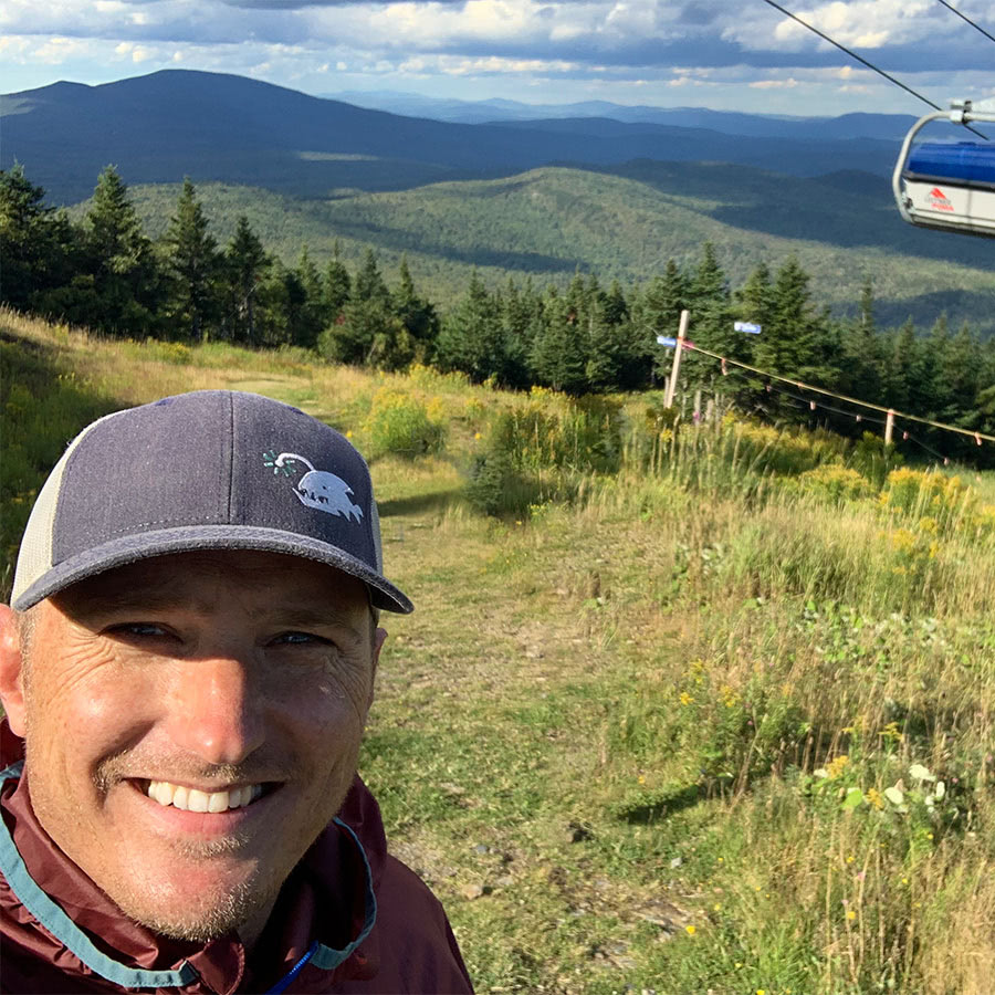 Gordon Holman, owner of SlickFish Studios, hikes in Vermont's Green Mountains.'