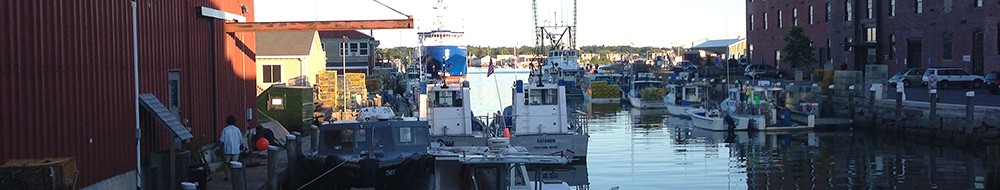 Lobster boats dock along a wharf in Portland